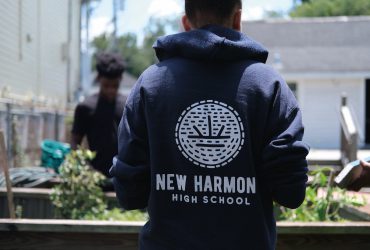 Young Student with a sweatshirt with New Harmony High School in text